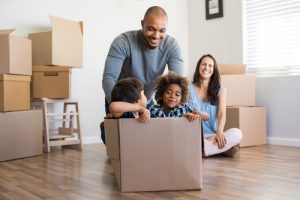 family packing their items to move houses