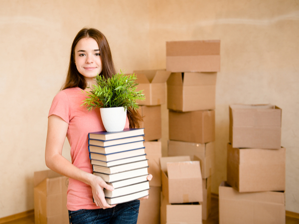 girl storing her belongings when she goes back to school