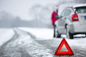 car stuck on road in winter