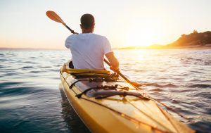 man kayaking in canada